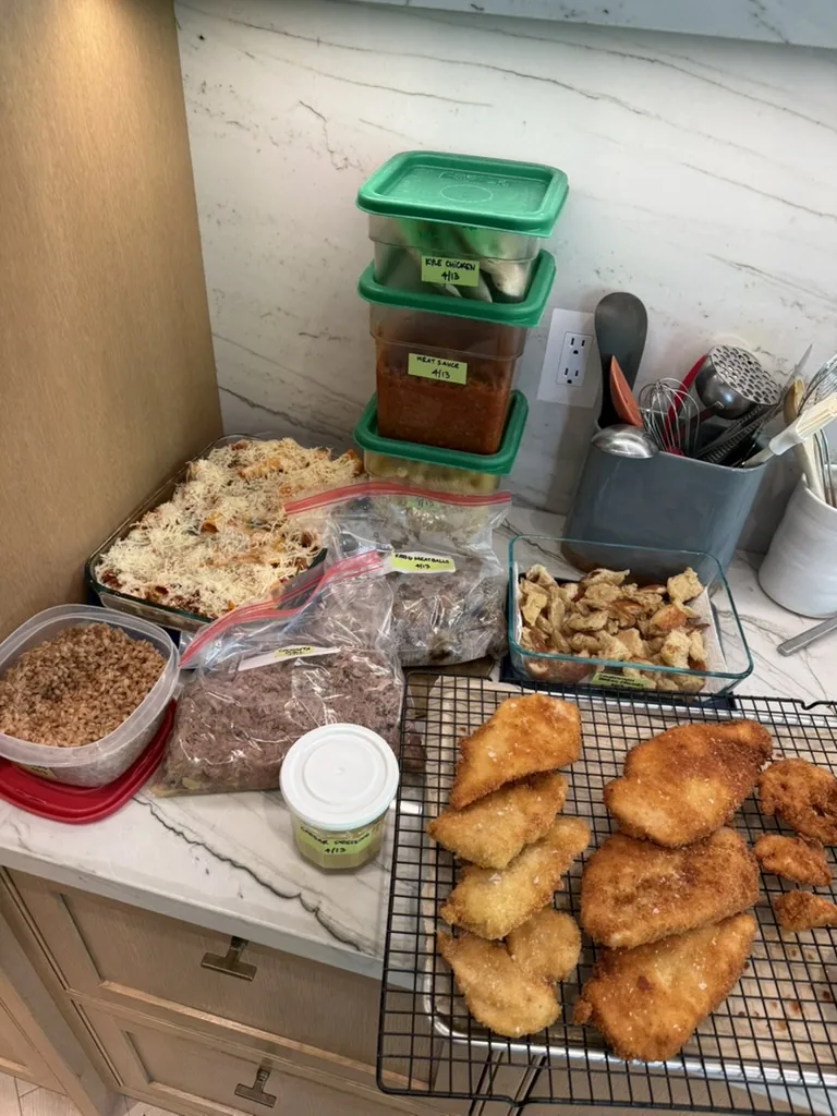 A week of prepared dishes including baked pasta, chicken cutlets, grains, and sauces