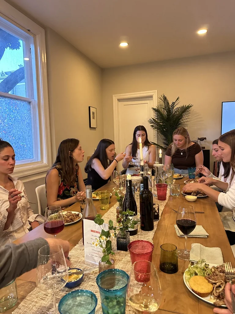 Guests gathered around a table for the bbq dinner