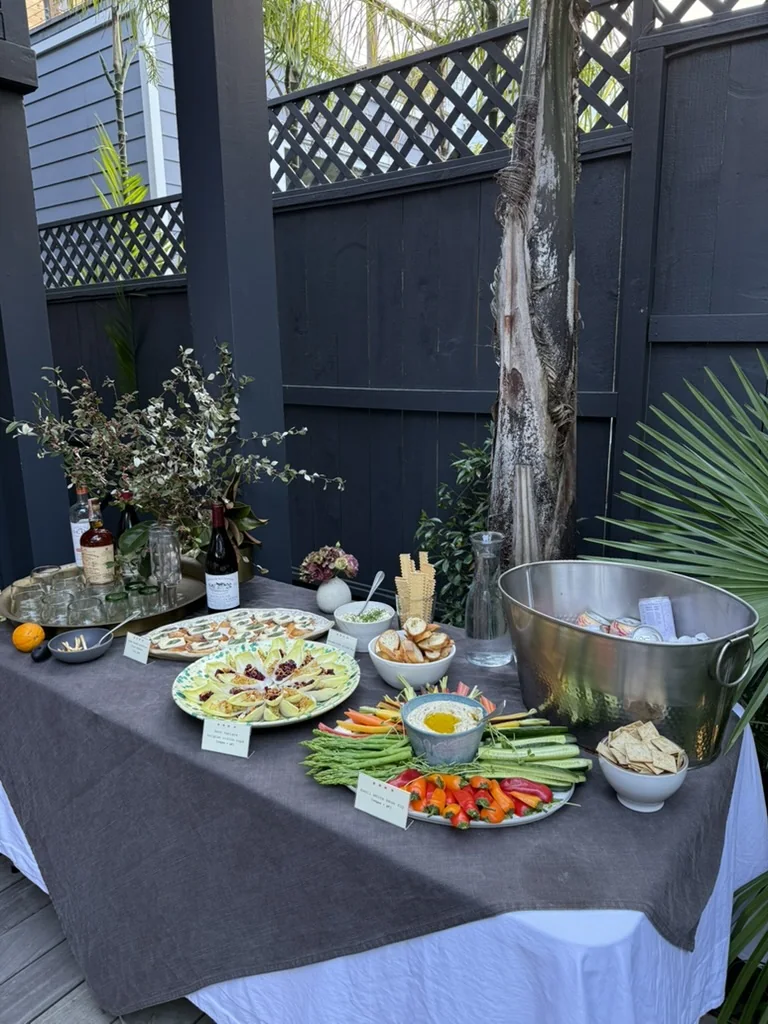 Outdoor appetizer table arranged for the benefit dinner
