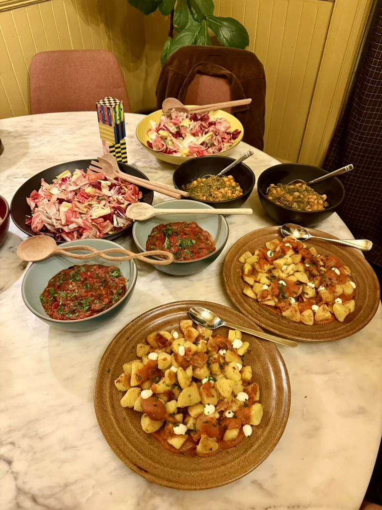 Spanish-inspired dishes arranged family-style on the table